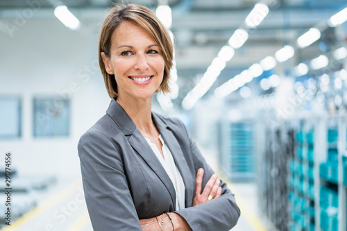 Portrait of a smiling businesswoman in a modern factory