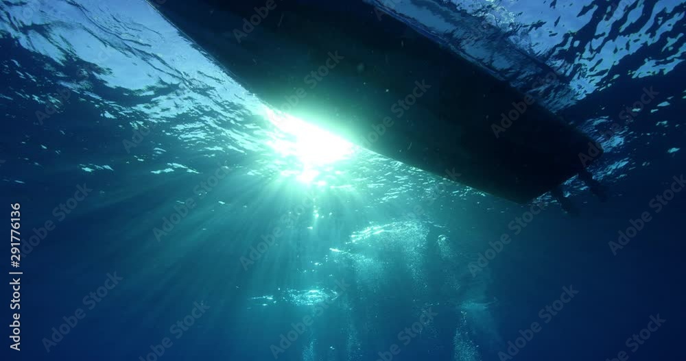 Low angle, view of boat form underwater Low angle, view of boat form underwater