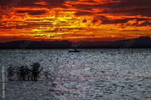 Fisherman on Cocibolca Lake at sunset photo