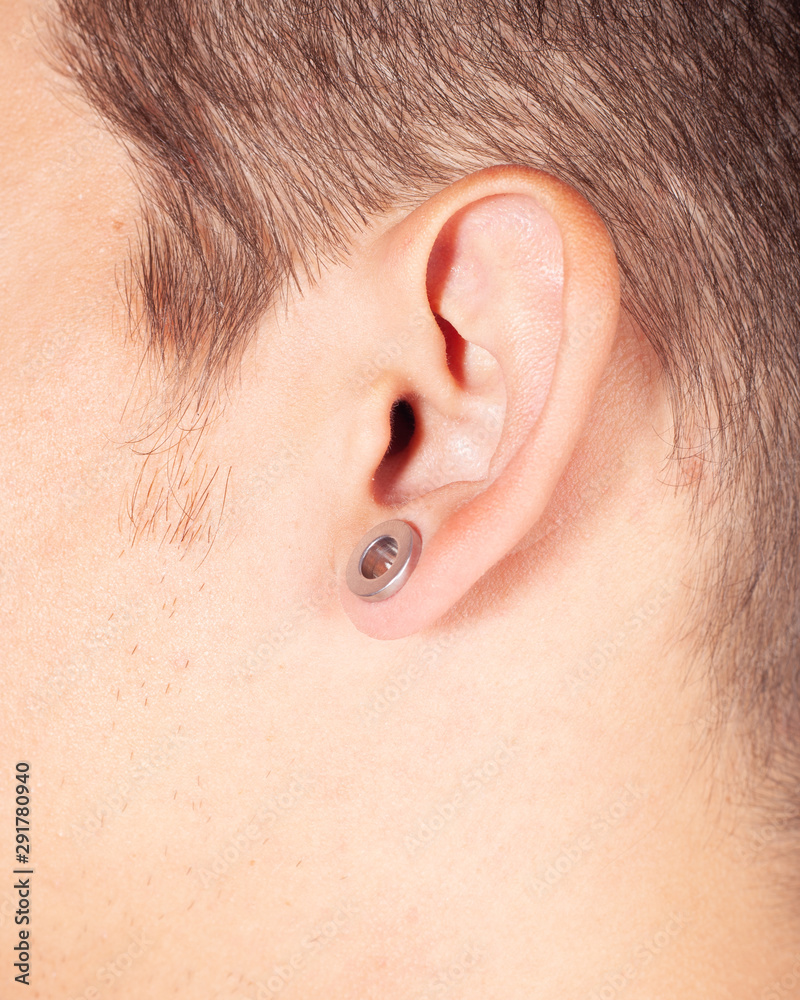 young guy with piercings in his ear