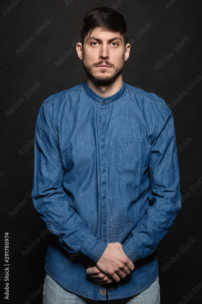 Alluring man posing in studio