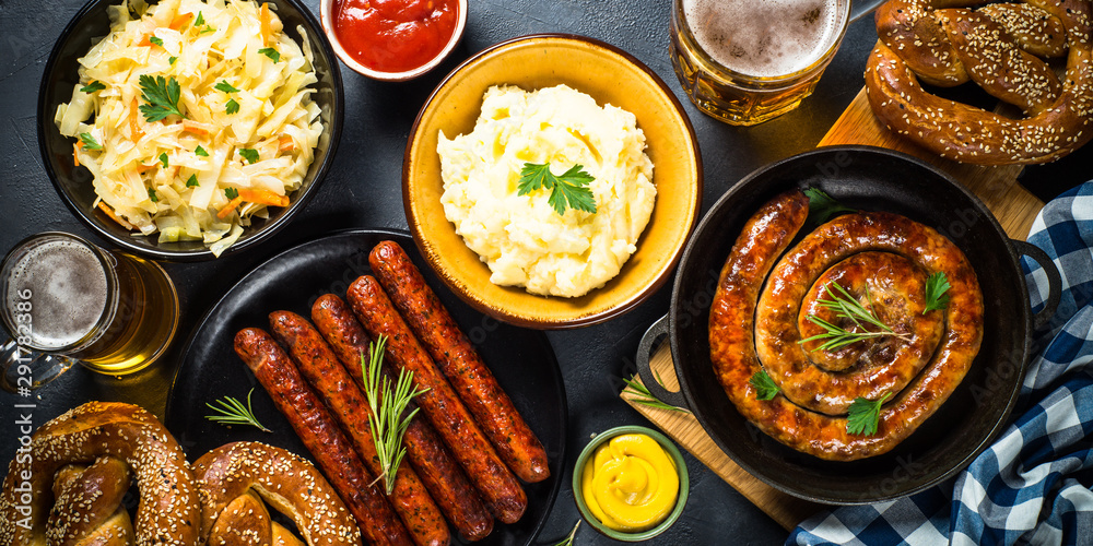 Fototapeta premium Oktoberfest food - sausage, beer and bretzel.