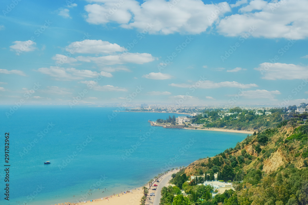 Sea, beach, promenade and coastal road in Sidi Bou said, top view. Mediterranean marine landscape, Tunisia. June, 2019