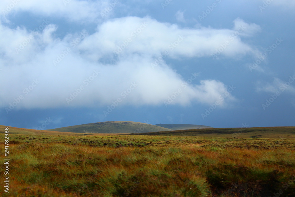 Sun shines above the clouds in a cloudy day in Ireland Sun shines above the clouds in a cloudy day in Ireland