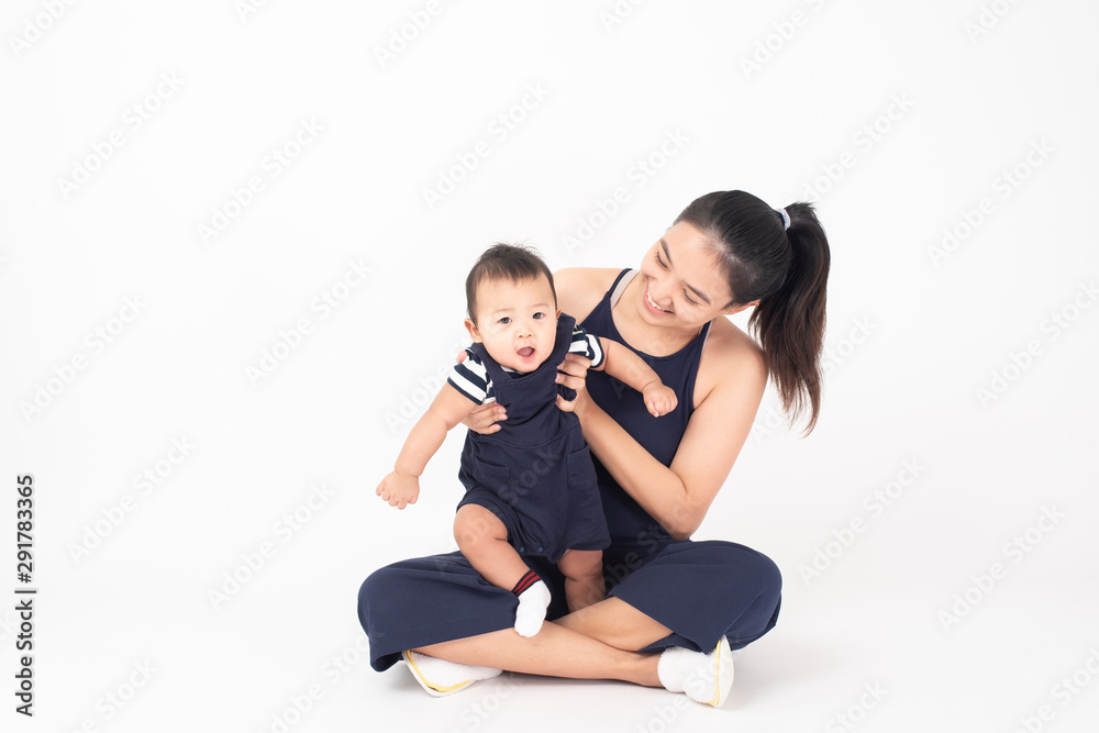 Happy newborn cute baby and beautiful mom in studio Happy newborn cute baby and beautiful mom in studio