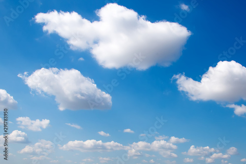 White clouds against a blue sky. The photograph of the sky