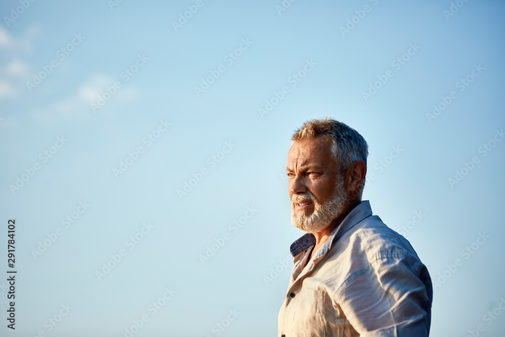 Portrait of a serious senior man outdoors Portrait of a serious senior man outdoors
