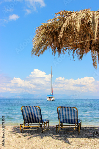 Benitses, Corfu Greece - Benitses Beach View of a Sail Boat in the Waters of the of the Ionian Sea photo