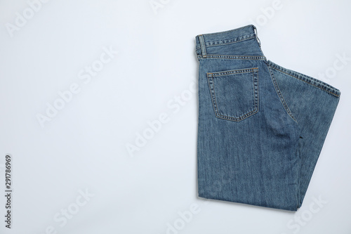 Jeans on white background, space for text