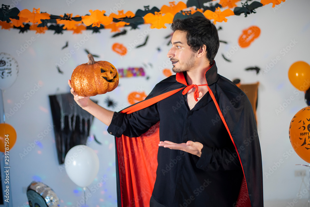 Fototapeta premium happy couple of love in costumes and makeup on a celebration of Halloween