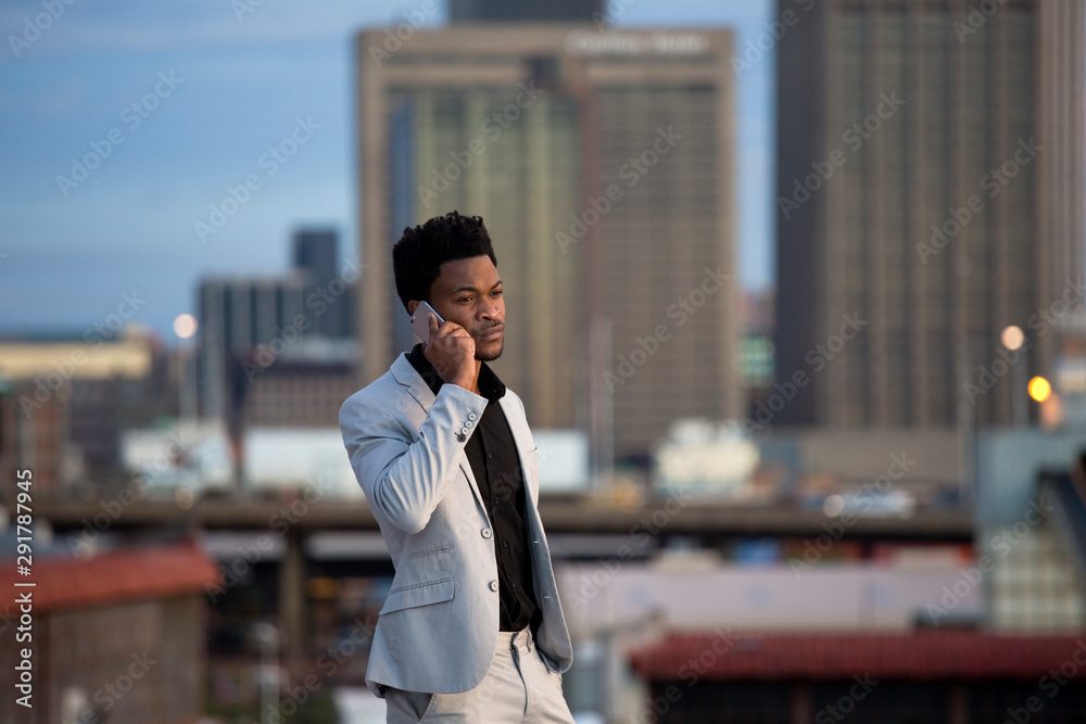 Business man talking on cell phone Business man talking on cell phone