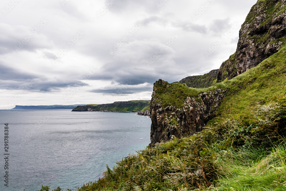 Ireland - coast view, green landscape, rough coasts, cliffs, monastery, graveyards and cloisters