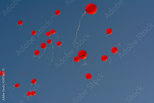 Wallpaper Mural red balloons  in blue sky festive procession soft focus lens flare sunlight soft focus lens flare sunlight. Abstract blurred cyan gradient of peaceful nature Torontodigital.ca