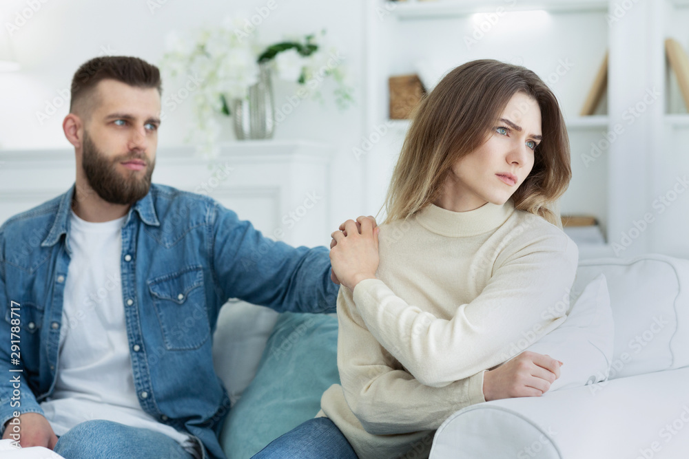 Relationship problems. Man consoling woman after argument Relationship problems. Man consoling woman after argument