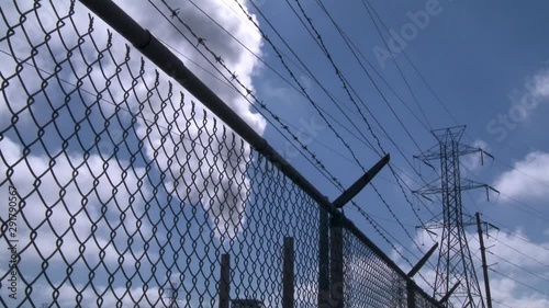 Smoke rises from factory, low angle