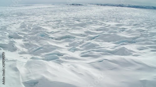 Point of view, helicopter flies over glacier