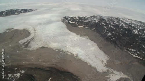 Aerial, view of glacial mountains from helicopter