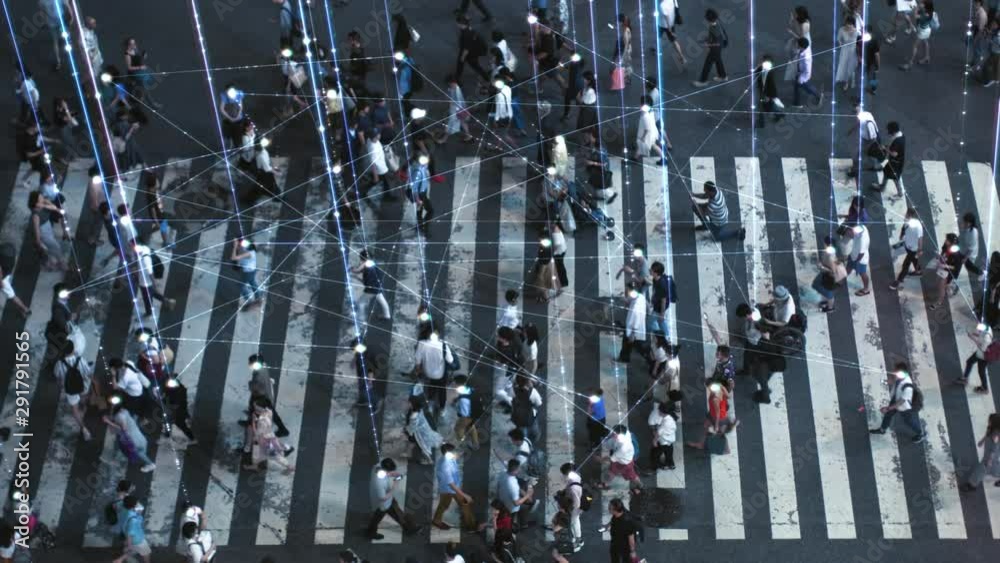 High Angle Shot of a Crowded Pedestrian Crossing in Big City. Augmented Reality Shows Visual Representation of Connected People with the Internet World, Technology Around Us and Wi-Fi  Wave Network.