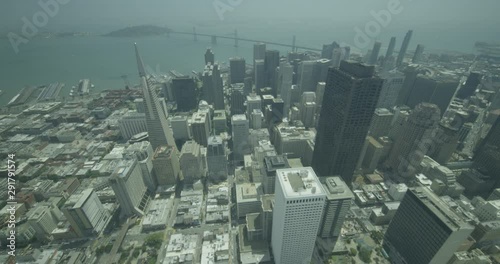 Helicopter aerial over San Fransisco city scape and Golden Gate bridge, day