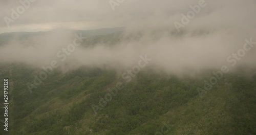 Wallpaper Mural Foggy helicopter aerial of greenery on mountainside, day Torontodigital.ca