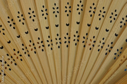 brown wooden texture from an old open fan with a pattern