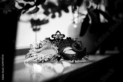 A black and white portrait of a venetian masquerade ball mask to hide your identity at carnavall and shroud yourself in mystery.