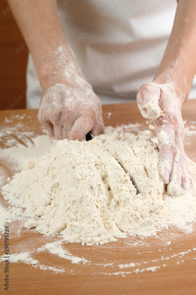 A baker cutting butter. Making Pastry Dough for Hungarian Cake. Series. A baker cutting butter. Making Pastry Dough for Hungarian Cake. Series.
