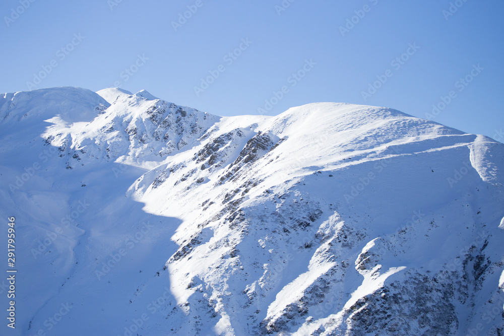Mountain peaks under heavy snow fall