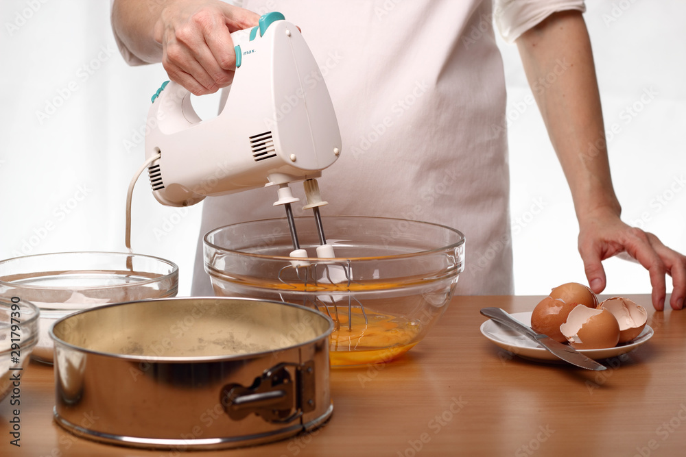 Beating egg. Making Victoria Sponge Cake. Series.