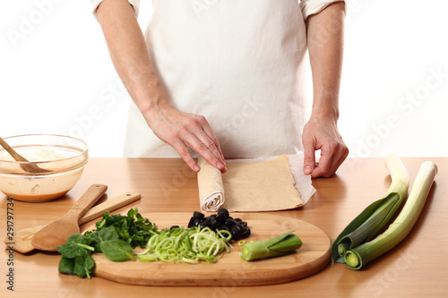 Roll out dough. Making Pizza with Leek and Spinach. Series.
