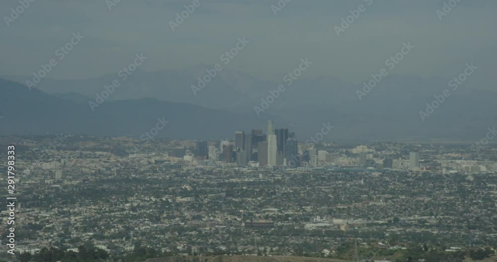 Helicopter aerial shot zooming out from downtown Los Angeles, foggy day Helicopter aerial shot zooming out from downtown Los Angeles, foggy day