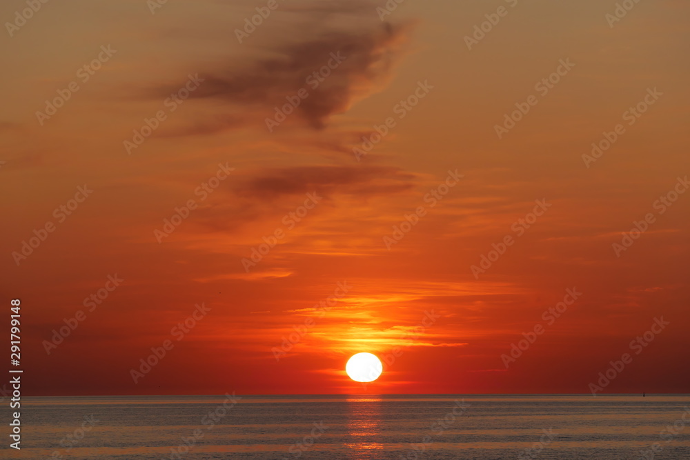 Very beautiful red sunset over the calm sea.