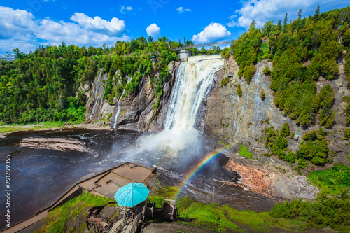 Fototapeta Naklejka Na Ścianę i Meble -  Landscape View of Montmorency Falls and Magnificent Rainbow in Montmorency Falls Park, Quebec, Canada