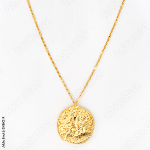 Fototapeta Vintage gold pendant necklace on gold chain, isolated