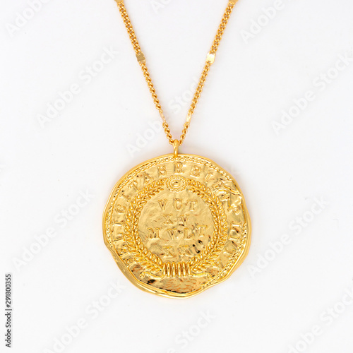 Vintage gold pendant necklace on gold chain, isolated