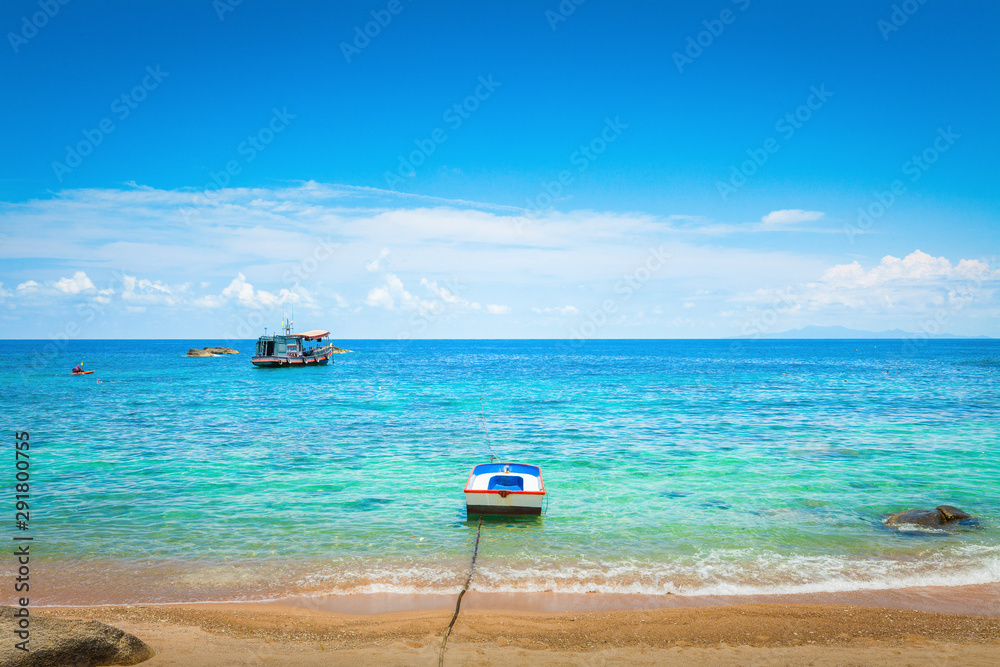 Tourist Boat on Tropical Beach Tourist Boat on Tropical Beach