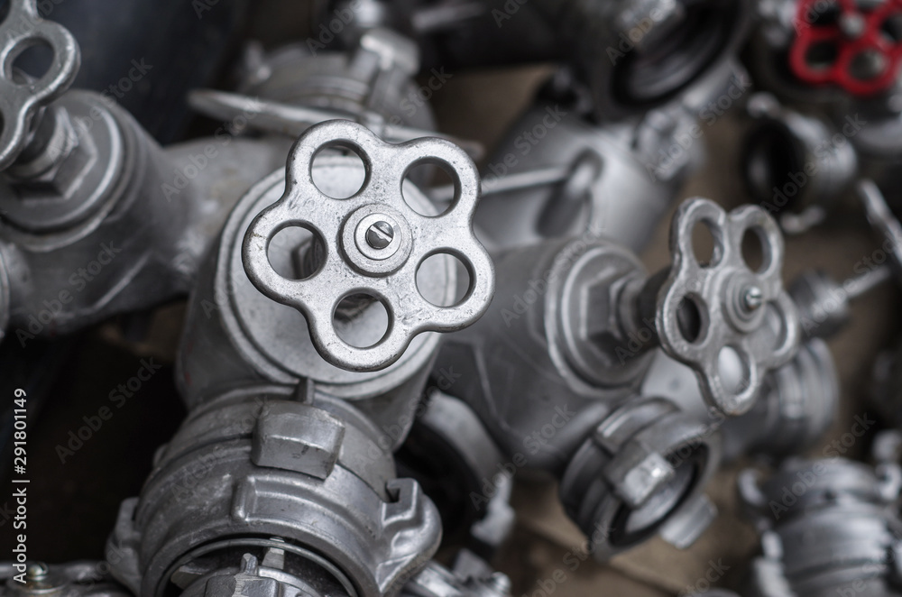 Industrial valves with red wheels. close-up of pipe valve connection Industrial valves with red wheels. close-up of pipe valve connection