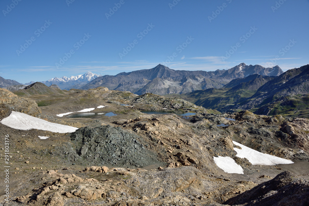 back from the tip of mean martin in vanoise, the plan of the ovens and its lakes and in the distance the mont blanc massif