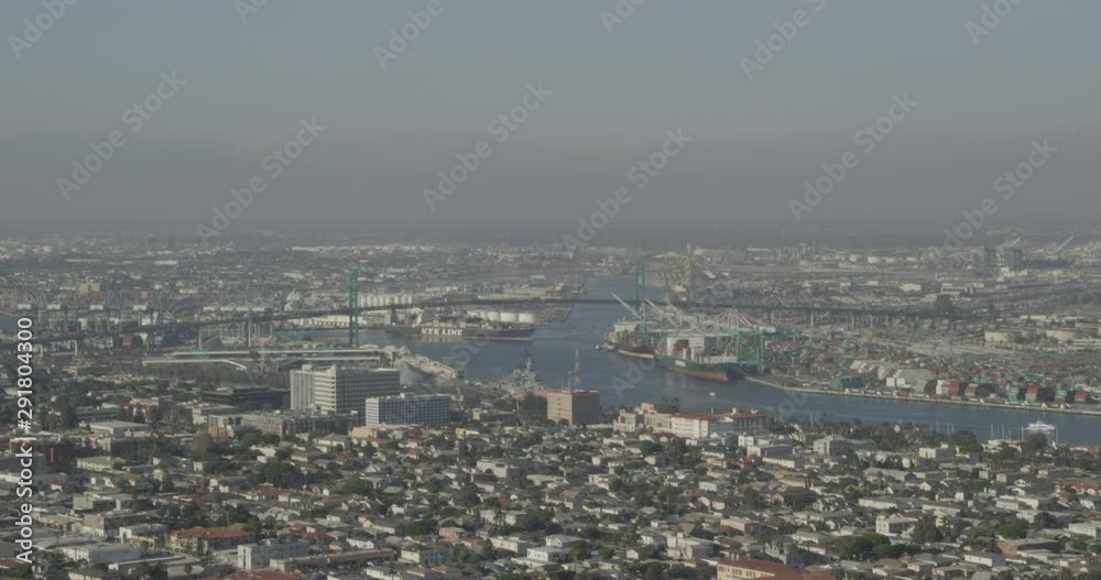 Helicopter aerial of bridge in industrial landscape, foggy day Helicopter aerial of bridge in industrial landscape, foggy day
