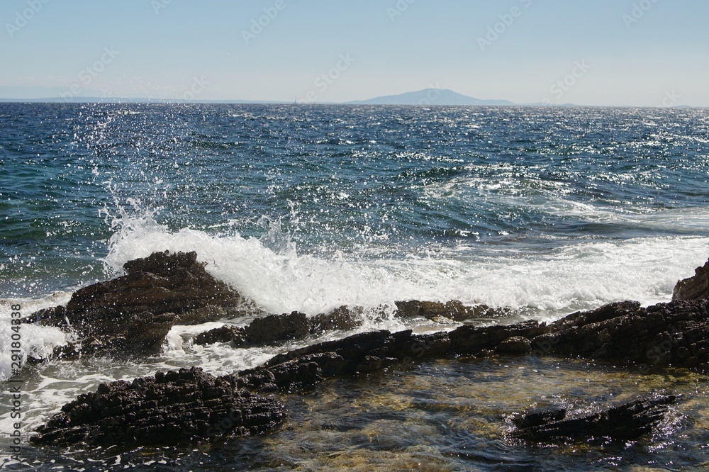 waves crashing on rocks