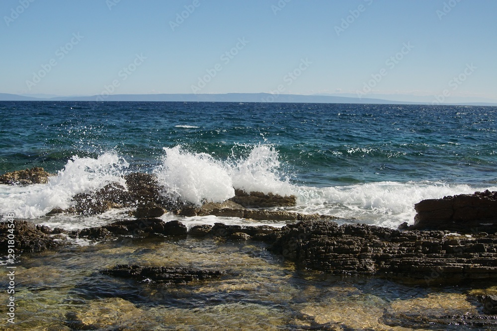 waves crashing on rocks