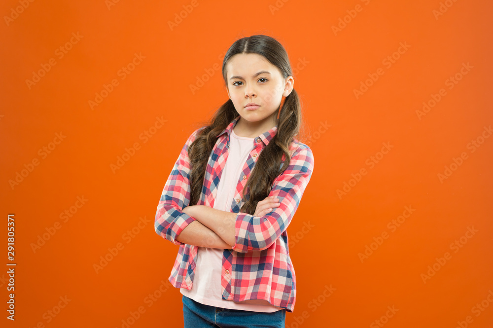 being upset. childhood memory. little girl orange background. kid fashion. serious school girl. worker uniform. kid long hair. small girl checkered shirt. sad child. childrens day being upset. childhood memory. little girl orange background. kid fashion. serious school girl. worker uniform. kid long hair. small girl checkered shirt. sad child. childrens day