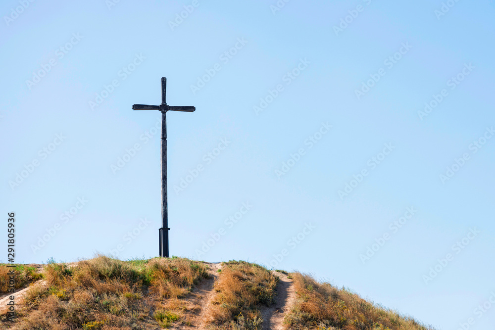 Cross on a mountain top on the sky background. Cross on top of mount Cross on a mountain top on the sky background. Cross on top of mount