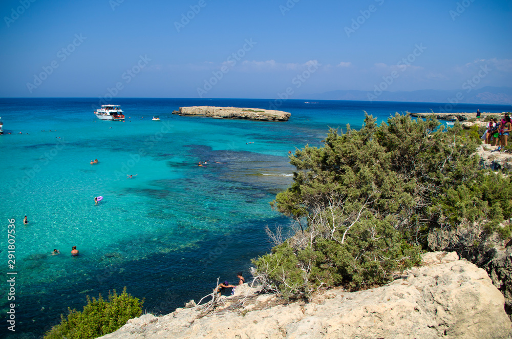 The Blue Lagoon with the people and boats at the summer sunny day, concept of a vacation