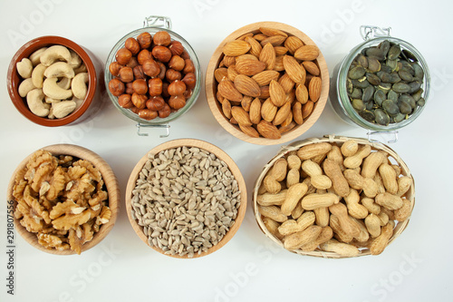 Nuts in bowls on a white background