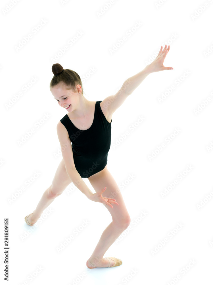 Little girl gymnast in a sports swimsuit.