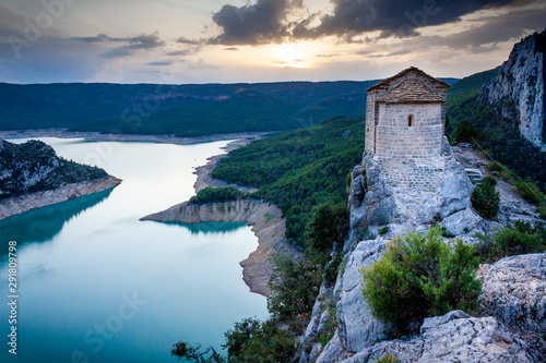 Lonely hermitage overlooking the lake. rocky landscape. La Noguera, Catalonia, Canelles Swamp