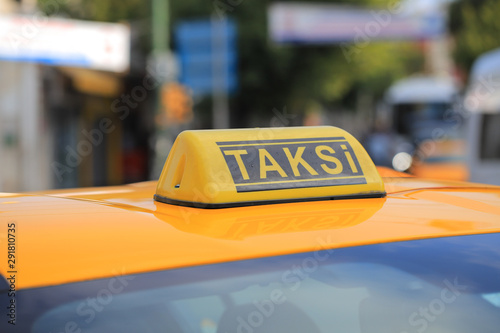 Yellow taxi car roof sign