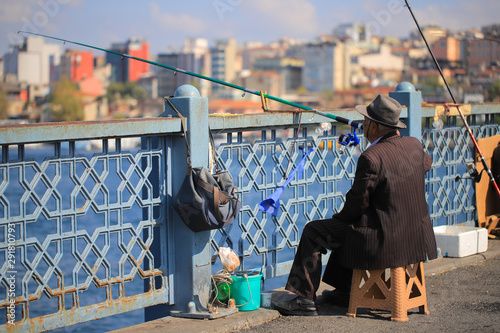 Slika na platnu Old fisherman catch fish on the bridge