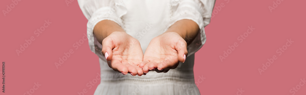 panoramic shot of young woman with cupped hands isolated on pink panoramic shot of young woman with cupped hands isolated on pink